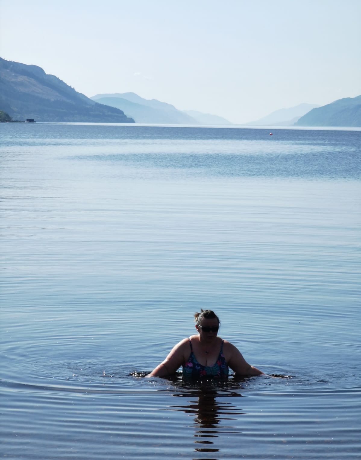 Photo of the silhoette of a female getting out of the water in Loch Ness