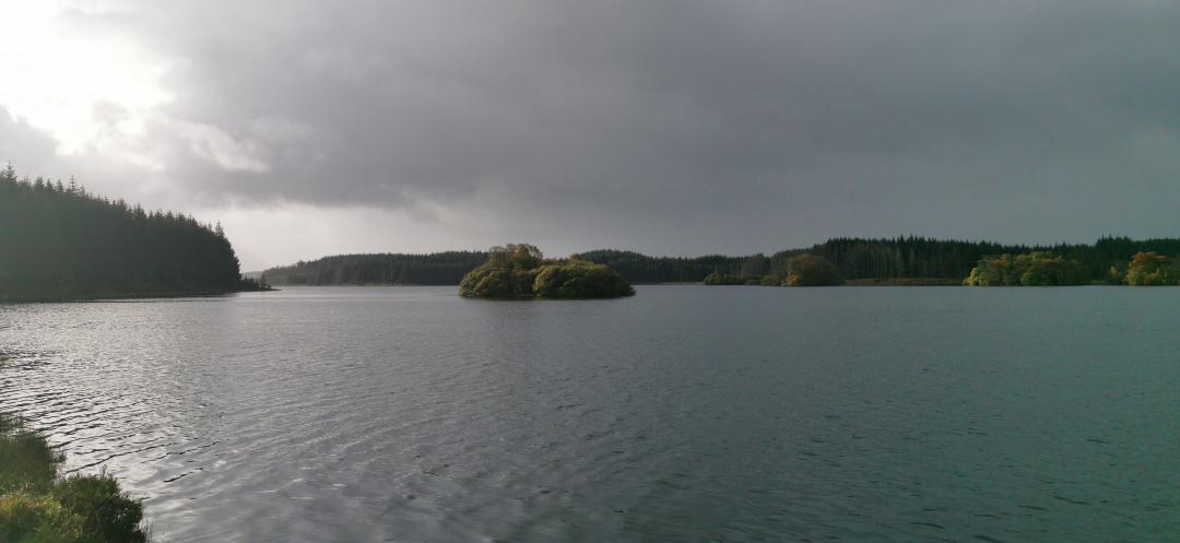 Image of a loch in Scotland. Dark and moody sky just before a storm