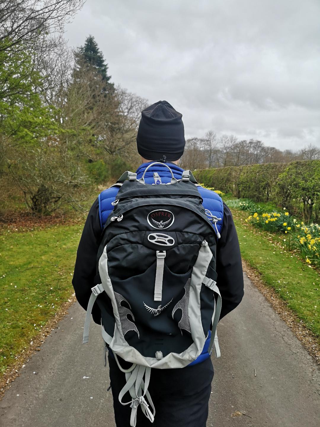 Photo of a man out walking wearing a rucksack